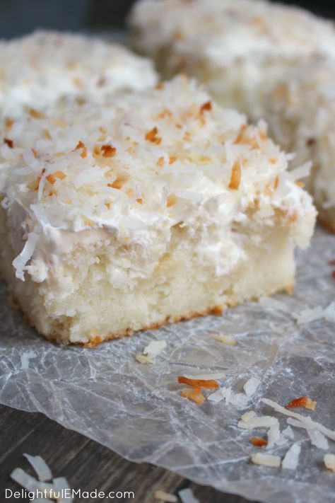 A dreamy, delicious coconut cake that will have you coming back for seconds!  Creme of coconut is baked into a fluffy white cake making it super moist.  The cake is then topped with coconut whipped cream and toasted coconut for the ultimate coconut treat! Coconut Cream Poke Cake, Cream Poke Cake, Coconut Poke Cakes, Cream Of Coconut, Coconut Cake Recipe, Poke Cake Recipes, Pumpkin Caramel, Poke Cake, Coconut Recipes