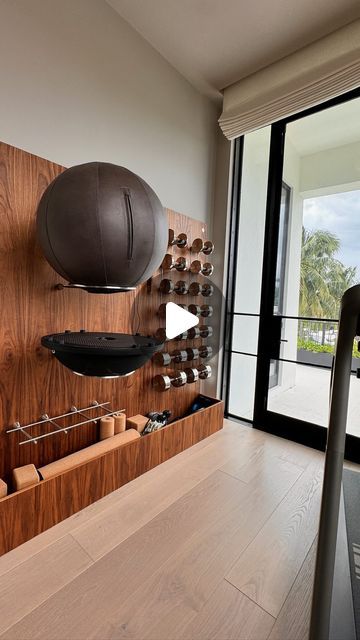 Paragon Studio on Instagram: "•PROJECT SPOTLIGHT• 📍Miami, Florida  The Paragon Studio team recently re-visited a luxury home gym project, completed earlier in the year, at a prestigious Miami address.  With a coastal view, we worked to our client’s brief ensuring we made the most of the small space available. As the gym would be used by the whole family, we supplied and fitted our bespoke wall unit to store essential gym equipment but keeping the floor space clear for yoga practice.   This project was completed alongside @parlorinteriors. With our stunning American Walnut wood and stainless steel finishes, the double wall unit was fitted alongside a @nohrd slimbeam and other accessories fit for a home work-out.   Find out more about our fully customisable wall units by heading over to the Gym Space Design, Luxury Home Gym, Gym Space, Steel Finishes, Space Clearing, Wall Units, Space Available, American Walnut, Floor Space