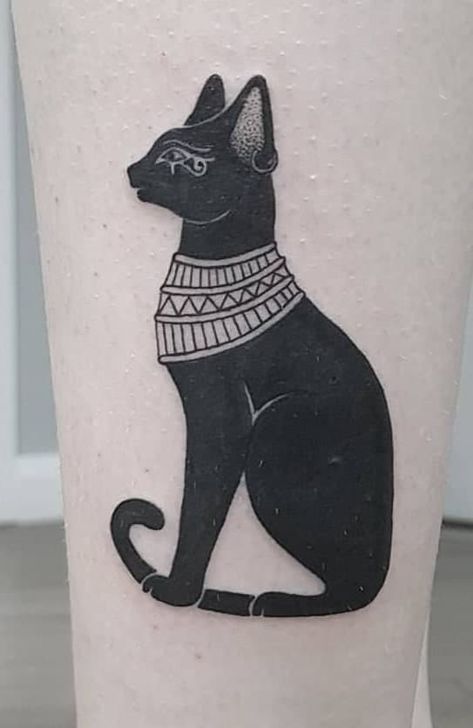 Bastet Tattoos: Meanings, Tattoo Designs & Ideas Bastet Cat Tattoo, Egyptian Cat Tattoo For Women, Cat Tattoo Egyptian, Egyptian Dog Tattoo, Anubis And Bastet Tattoo, Egypt Cat Tattoo, Bastet Tattoo Egyptian, Sekhmet Tattoo, Ma'at Tattoo