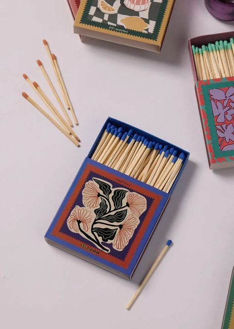 Every candle has its match. These sets of 100 matches come in a hand illustrated work of art matchbox. Each box features metallic or glossy accents, two strikers, and all 100 match tips are colored to match the design. Jumbo matches are a perfect accessory to gift with any Paddywax candle. Glossy Accents, Paddywax Candles, Candle Bar, Valentines Gift Guide, Art District, Wholesale Gifts, Subscription Gifts, Incense Cones, Taper Candles