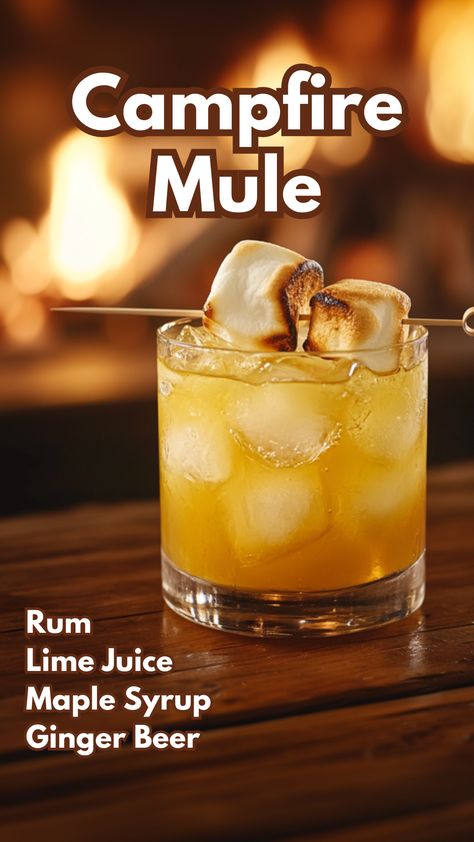 The Campfire Mule is a smoky twist on the classic Moscow Mule, combining the richness of Campfire Rum with the refreshing bite of lime and ginger beer. Maple syrup adds a touch of sweetness, while toasted marshmallows for garnish give this drink a playful, campfire-inspired finish. #campfiremule #campingcocktails via @mybartender Halloween Drinks Alcohol Whiskey, Fall Rum Drinks, Campfire Drinks, Camping Cocktails, Booze Recipes, Autumn Beverages, Ginger Beer Drinks, Maple Cocktail, Cocktails Made With Rum