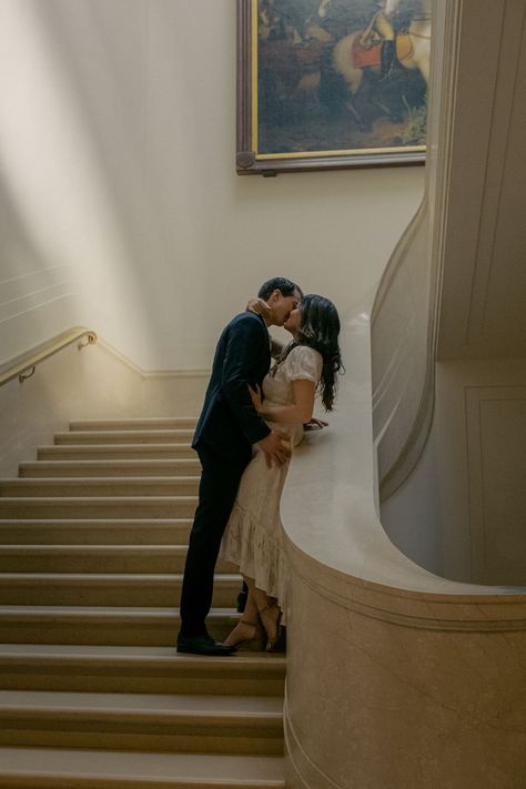 A romantic couple kissing on a white marble staircase Dc Engagement Photos, Art Gallery Wedding, Engagement Pictures Poses, Engagement Inspo, Bridal Photoshoot, Washington Dc Wedding, Engagement Photo Poses, Museum Wedding, Dc Wedding