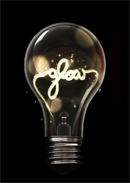 Glow. What if we made a flat lightbulb, with the word 'breakthrough' as the filament? You could cut a incandescent lightbulb shape out of cardboard, cover it in plastic wrap, to give it a shiny look. Then place a coat hanger (or pipe cleaner) bent into the word, on top. Yearbook, Light Bulb