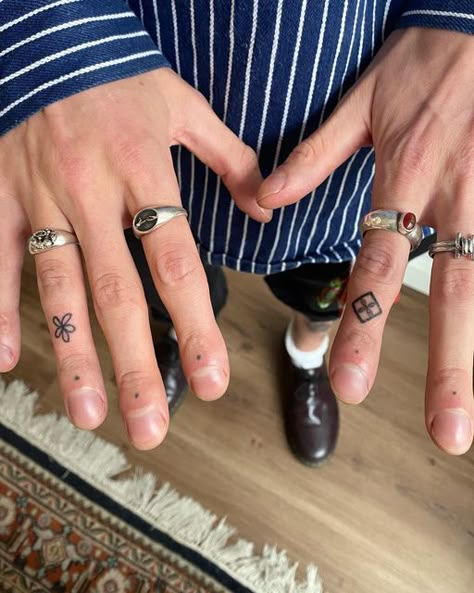 Hand Tattoos Small Men, Red Stick N Poke Tattoo, Men’s Finger Tats, Make Hand Tattoos, Alternative Hand Tattoo, Hand Tattoos Numbers, Hand Shape Tattoo, Finger Text Tattoo, Stick And Poke Tattoo Men