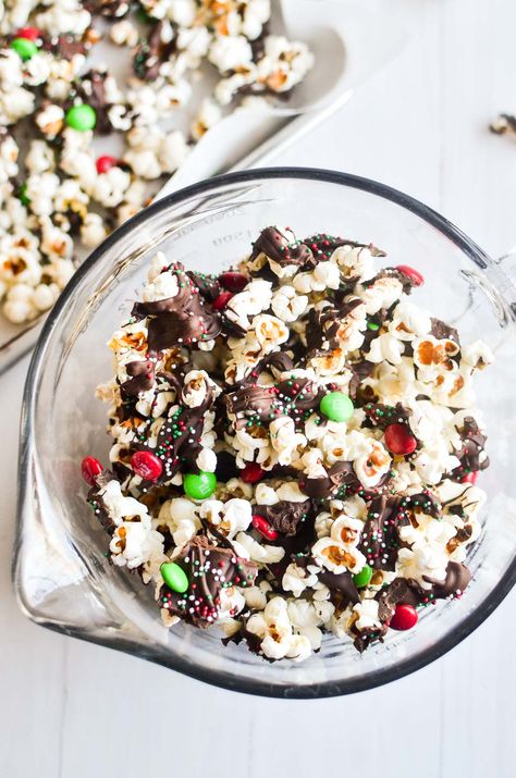 Our Christmas Popcorn Snack Mix is sweet, salty, crunchy, and fun to eat. This easy chocolate covered party mix is a new holiday tradition! #snack #popcorn #partymix #Christmas #snackmix #dessert #chocolate Chocolate Covered Popcorn Christmas, Popcorn Snack Mix Recipes, Popcorn Mix Recipes, Covered Popcorn, Pretzel Mix, Chocolate Covered Popcorn, Yogurt Covered Pretzels, Christmas Popcorn, Popcorn Mix