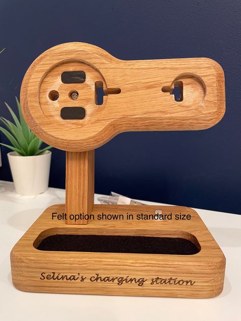 A triple handcrafted solid oak or ash iPhone MagSafe, Apple Watch and AirPods charging stand. An ultra convenient adjustable dock, just place the iPhone on the charging stand for a secure, aligned connection in portrait or landscape mode. Slip the Apple Watch alongside, the watch will default to night stand mode and entirely conceal the MagSafe charger. AirPods fit onto the lightning/USB-C connector (provided). Swivel function to adjust to preferred position, making an even more user friendly do Apple Watch Charger Stand Diy, Magsafe Stand, Iphone Wireless Charger Stand, Apple Watch And Airpods, Apple Charging Station, Diy Phone Stand, Iphone Docking Station, Apple Watch Charging Stand, Magsafe Charger