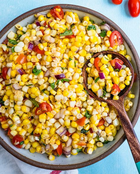 This easy corn salad is fresh and full of tangy flavor, with bursts of bright tomato and basil! The classic summer salad for BBQs and picnics. #cornsalad #corn #salad #summersalad #summerrecipe #vegan #plantbased Cold Corn Salad, Corn Dressing, Easy Corn Recipes, Easy Corn Salad, Fresh Corn Salad, Grilled Corn Salad, Creamy Potato Salad, Corn Salad Recipes, Creamy Corn