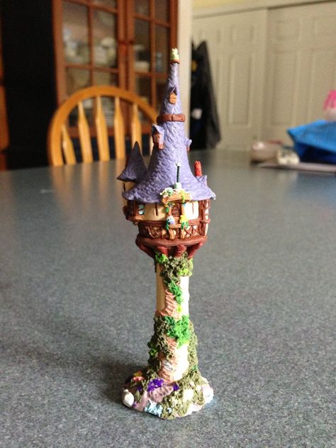 Polymer clay miniature of Rapunzel's tower from Disney's Tangled It is about 4 inches in height and took a few hours to make. Rapunzel's Tower, Disney Punk, Rapunzel Tower, Polymer Clay Disney, Polymer Clay Miniature, Clay Fairy House, Punk Disney, Clay Fairies, Diy Fairy