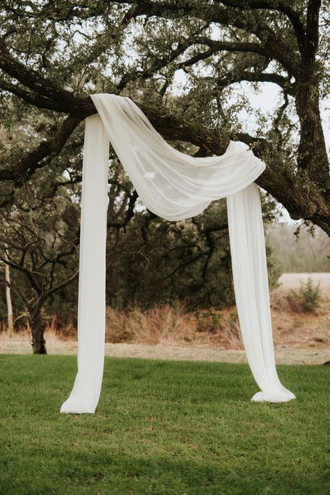 Click to look through more photos from this beautiful Pecan Springs Ranch wedding // Austin Wedding Photography // Pecan Springs Ranch Wedding Photography // Texas Wedding Photographer // Austin Wedding Venue // Austin Wedding Photographer // Bride and Groom Photos Simple Wedding Walkway Decor, Low Key Outdoor Wedding, Minimalistic Outdoor Wedding, Outdoor Wedding Tree Decor, Light Arch Wedding, Fabric Decor Wedding, Outdoor Wedding Arbor, Wedding Backdrop Alter, Simple Wedding Backdrop Outdoor