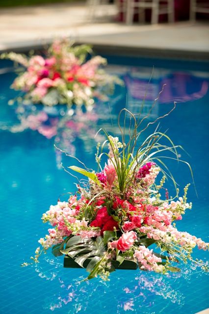 Just one bouquet in the middle of the pool might be really nice.  We'll have to anchor it with the shallow-end line. Pool Floral Decor, Floating Floral Arrangements Pool, Diy Floating Flowers In Pool, Floating Flowers In Pool, Pool With Flowers, Flowers In Pool, Floating Floral Arrangements, Floating Pool Flowers, Backyard Wedding Pool