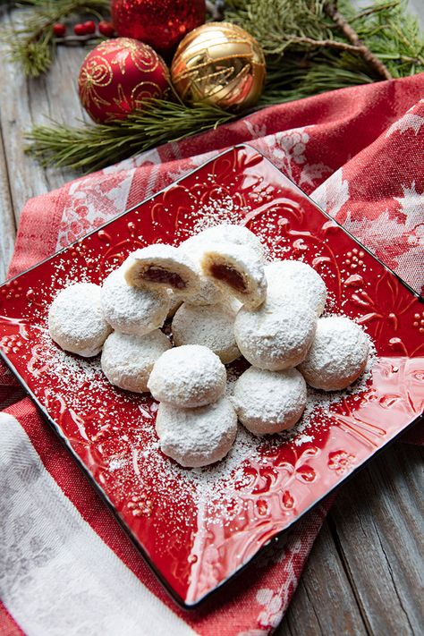 Filled Almond Snowball Cookies | Italian Food Forever Raspberry Snowball Cookies, Raspberry Filled Snowball Cookies, Almond Snowball Cookies, Raspberry Filled Almond Snow Cookies, Eggnog Snowball Cookies, Raspberry Filled Almond Snowball Cookies, Jam Filled Snowball Cookies, Stuffed Cookies, Snow Cookies