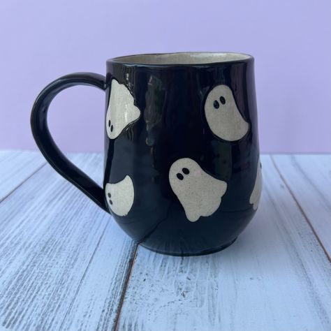 👻This Black Ghost Ceramic Coffee mug is handmade and perfect for the coffee or tea lover in your life!  👻It is unique handmade pottery mug with a tan stoneware cone 6 clay.  👻The Ghosts are absent of glaze with a food safe coating of liquid quartz to seal and protect the cone 6 stoneware underneath  making the mug dishwater safe.  👻Dishwasher safe.  👻Microwave safe.  👻lead free and food safe glaze used.  👻Holds 16 oz fluid  👻105 mm tall 110 mm wide Ghost Ceramic, Autumn Mugs, Pumpkin Spice Tea, Black Ghost, Diy Pottery Painting, Fall Mug, Cute Autumn, Pottery Painting Designs, Diy Ceramic