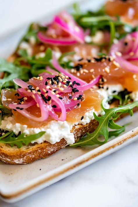 Indulge in a delightful breakfast with this Cottage Cheese and Smoked Salmon Toast recipe. This dish offers a perfect balance of creamy cottage cheese, savory smoked salmon, and fresh herbs on crispy toast. It's a quick and easy meal that's not only delicious but also high in protein and nutrients. Whether you enjoy it as a savory breakfast, light lunch, or afternoon snack, this dish is sure to satisfy your cravings.  Ingredients 2 slices toasted sourdough bread 2/3 cup cottage cheese Hot honey, Cottage Cheese Savory, Cottage Cheese Salmon Toast, Sourdough Cottage Cheese Toast, Cottage Cheese And Avocado Toast, Cottage Cheese Egg Toast, Cottage Cheese Honey Toast, Smoked Salmon Toast, Gourmet Toast, Low Calorie Pancakes