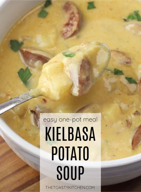 Kielbasa potato soup recipe by The Toasty Kitchen. Kielbasa potato soup is a hearty soup filled with sausage, potatoes, and shredded cheddar cheese. Pair this creamy, comforting soup with some crusty bread or a side salad for a quick and filling weeknight meal. #kielbasa #potatosoup #creamysoup #heartysoup #wintermeals #cheese #sausage #recipe #Homemade Kielbasa Soup With Potatoes, Potato And Kielbasa Soup, Kielbasa Potato Soup, Cheesy Kielbasa, Kielbasa Soup, Chicken Asian, Soup Potato, Sausage Potato Soup, Bratwurst Recipes