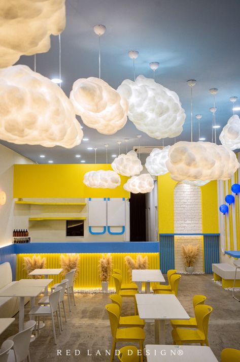 The playful combo of yellow 🟡, skye blue, and white turns this limited space into a vibrant teenage zone. Yellow Coffee Shop, Yellow Restaurant, Colorful Cafe, Land Design, Blue Cafe, White Restaurant, Selfie Wall, Gelato Shop, Yellow Theme