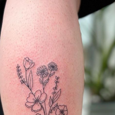 Wildflowers | Fine Line Tattoo on Instagram: "Mom’s flower drawing on the leg 💐💞✨ #flowerdrawing #flowerbouquets #wildflowertattoo #finelinetattoos #torontotattoo #qttr #queerartist #lineworktattoo #gardenflower #whimsicalart" Fine Line Wildflower Tattoo, Wild Flower Tattoo, Wildflowers Tattoo, Flower Leg Tattoos, Wildflower Tattoo, Instagram Mom, Fine Line Tattoo, Line Tattoo, Line Work Tattoo