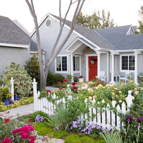 Get the cottage-garden look with our tips: http://www.bhg.com/gardening/landscaping-projects/landscape-basics/front-yard-flower-power/?socsrc=bhgpin062414cottagegardenlook&page=2 Shed Inspiration, Small Front Yard Landscaping, Small Front Yard, Cottage Garden Design, White Picket Fence, House With Porch, Front Yard Garden, Picket Fence, Garden Cottage