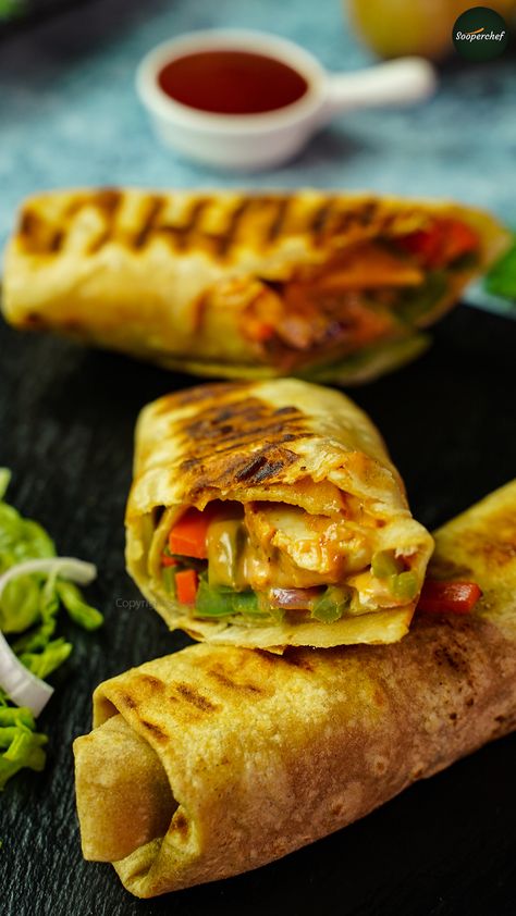 Chicken Roti Roll filled with saucy tandoori chicken is a treat to your taste buds. A wholesome meal for your lunch and breakfast is worth your effort. Try out this Tandoori Chicken Roll and share your feedback with us. #ChickenRotiRoll #ChickenRoll #ParathaRoll #pinterestrecipes #pinterestideas #pinterestworthy #foodphotos #foodpics #foodphotography #foodimages #pinterestinspired #foodstyling #Sooperchef #foodpresentation Roti Roll Recipe, Achari Chicken, Heavy Meals, Chicken Roti, Paratha Roll, Rolled Chicken Recipes, Zesty Chicken, Chicken Roll, Chicken Tikka Masala Recipes