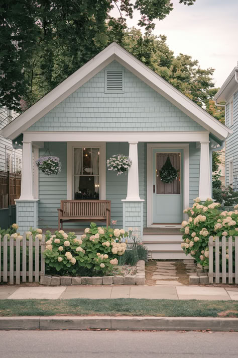 The 107 Best Exterior House Colors Light Blue Craftsman Exterior, Colour Of Houses Outside, Modern Lake Cottage Exterior, Cottage House Paint Colors Exterior, Light Teal Exterior House Paint, Tiny Craftsman House, French Blue Exterior House Colors, Blue House With Porch, Light Green Home Exterior