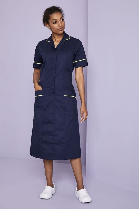 Simon Jersey Women's Unhemmed Healthcare Dress, Navy/Lime Features      Concealed zip with press stud fastening    Action pleats at back for ease of movement    Sleeve darts for shaping    Two inset hip pockets with piping, waterproof breast pocket and additional breast pocket    65% Polyester, 35% Cotton      Fabric Weight:   195gsm      Length:   100cm-112.5cm    Unhemmed Length: 122cm    We recommend washing this garment at 60°    Easy care garment, requiring minimal ironing      If you requi Simon Palfrey Dress, Nurse Scrub Dress, Scrub Dress, Scrubs Fashion, Pokemon Iris, Medical Scrubs Fashion, Nurse Dress, Nurse Dress Uniform, Beauty Uniforms