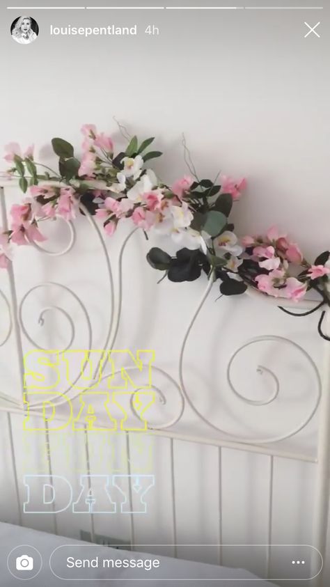 Fake flowers wrapped around headboard. Add fairy lights? Flowers On Bed Frame, Headboard Fairy Lights, Flowers On Headboard, Diy Floral Headboard, Elsa Room, Flower Headboard, France Bedroom, Lights Above Bed, Glam Bedrooms