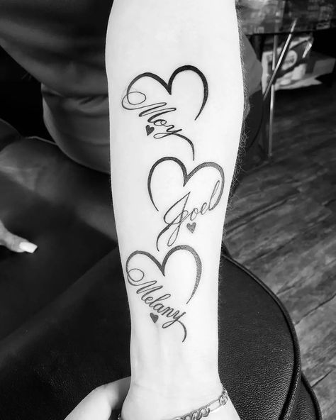 Open Heart Tattoo With Names, Heart Tattoo Memorial, Tattoo Ideas With Daughters Name, Moms Tattoo Ideas For Kids, Hearts With Birthday Tattoo, Names With Hearts Tattoos, Love Heart Tattoo With Name, Heart With Name Tattoo Ideas, Tattoo Heart With Names