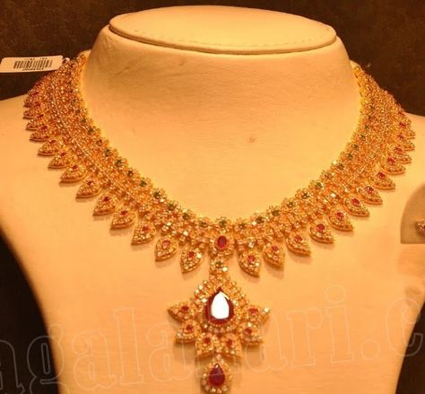 Beautiful uncut diamond necklace with leaf pattern, studded with rubies and emeralds by Malabar gold and diamonds. Malabar Gold Jewellery Necklaces, Malabar Gold Jewellery, Gold Ruby Necklace, Uncut Diamond Necklace, Diamond Necklace Indian, Gold Bridal Necklace, Choker Necklace Designs, Gold Necklace Indian, Jewellery Necklaces