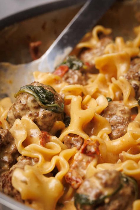 30-minute Marry Me Beef Meatball Pasta! This one-pan recipe combines tender meatballs, al-dente pasta, and a creamy sun-dried tomato sauce. Crockpot Meatball Pasta Recipes, Italian Meatball Pasta Recipes, Meatballs And Elbow Macaroni, Creamy Pasta With Meatballs, Meatball Mix Recipes, Dinners With Meatballs, Italian Meatball Dinner Ideas, Pasta And Meatballs Recipes, Meatball And Pasta Recipes