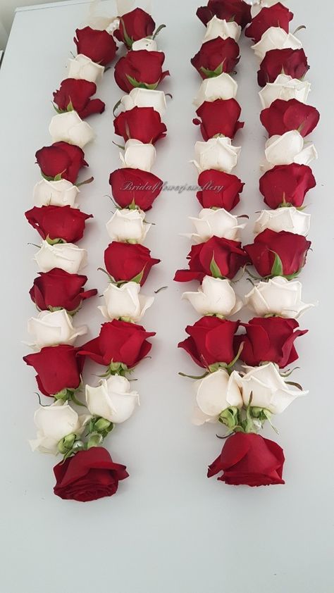 Fresh flower garlands using fresh red roses. flower jewellery by Bridal Flower Jewellery www.bridalflowerjewellery.com #bridalflowerjewellery #shaadi #haar #wedding #garland  #flowerjewellery #floraljewellery #flowerhoops #flowerearrings #flowerbangles #flowerbracelets #mehndi #mehndiflowers #mehndijewellery Varmala Ideas, Bangel Design, Flower Mala, Rose Garland Wedding, Flower Garland Diy, Indian Wedding Garland, Flowers Jewellery, Indian Wedding Flowers, Lavish Wedding