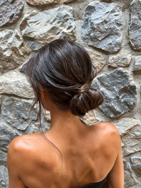 Low Bun With Loose Curls, Prom Simple Updos, Dark Hair Low Bun, Undone Bun Wedding, Simple Bun Hairstyles Wedding, Prom Updos Simple, Effortless Bun Hairstyles, Low Messy Bun Brown Hair, Minimalist Bridesmaid Hair