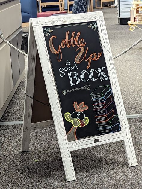 Thanksgiving Library Chalkboard Signs, Bookstore Chalkboard, Thanksgiving Chalkboard, Library Book Displays, Book Displays, Elementary Library, Sandwich Board, Chalkboard Sign, Book Worm