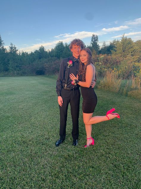 black short homecoming dress, neon shoes, black suit, pink and black hoco look, prom, homecoming picture ideas, couple photo ideas, instagram 

inspiration, golden hour, good lighting Black Homecoming Couple Outfits, Matching Homecoming Couples Green, Pink And Black Homecoming Couple, Hoco Date Pictures Black Dress, Places To Take Hoco Pictures, Black Dress Hoco Couple, Casual Hoco Outfits For Guys, Red And Black Homecoming Couple, Black And Red Hoco Couple