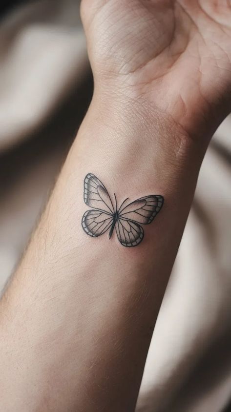 10 Delicate Butterfly Wrist Tattoo Designs to Inspire Your Next Ink 3 White Butterfly Tattoo, Black Butterfly Tattoo, Colorful Butterfly Tattoo, Unique Wrist Tattoos, Butterfly Wrist Tattoo, Wrist Tattoo Designs, Black And White Butterfly, White Butterflies, Butterfly Designs