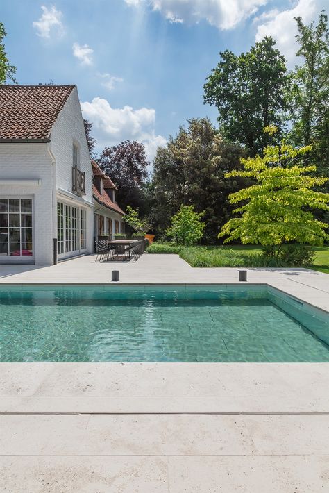 In this villa in the  the limestone Pietra Bicci was applied as outdoor flooring and pool copings. To completely integrate a swimming pool into the garden, you can use pool copings to guarantee a perfect transition. Limestone Coping Pool, Grey Travertine Pool Deck, Limestone Pool Deck, Limestone Pool Paving, Limestone Pool, Ivory Travertine Pool Coping, Backyard Pavers, Shellstone Limestone Pool Deck, Pool Inspiration