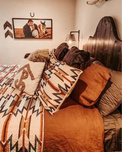 http://liketk.it/34HJy #liketkit @liketoknow.it #LTKhome @liketoknow.it.home Shop your screenshot of this pic with the LIKEtoKNOW.it shopping app Western Burnt Orange Bedding, Western Bedding Farmhouse, Western Bedding Ideas Ranch, Aztec Bedding Western, Western Master Bedrooms Decor Cozy, Orange Western Bedroom, Western Ranch House Decor, Western Master Room Bedroom Ideas, Western Bedroom Ideas Ranch Style Rustic