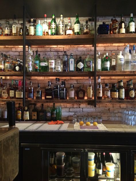 Ghibelline bar, 14th St Corridor. Love these rustic-looking wood shelves. Industrial Bar Shelving, Rustic Bar Shelves, Rustic Sports Bar, Behind Bar Ideas, Rustic Bar Ideas, Back Bar Shelving, Bar Backs, Sport Bar Design, Cafe Bar Interior