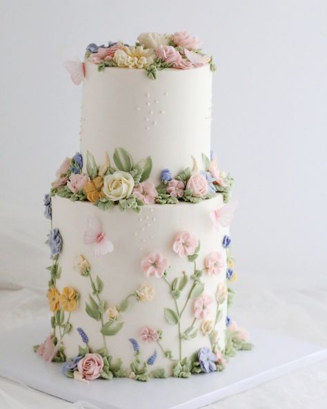 Buttercream wildflowers and roses two-tier cake. Pastel Wedding Cake Flowers, Flower Cake 2 Tier, Flower Petal Cake, Two Tier Flower Cake, 3 Tier Cake Designs For Birthday, Buttercream Wildflowers, 2 Tier Floral Cake, Two Tier Cake Birthday, 2 Tier Cake Ideas