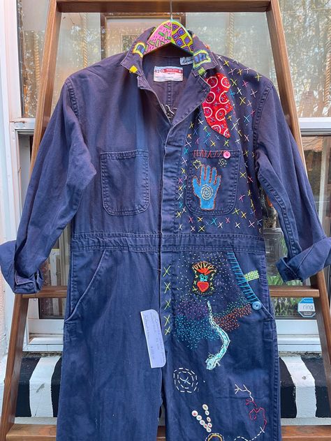 One of a kind, bespoke coverall/boiler suit; long sleeve; 100% cotton; stitched, patched; button front; 42 X 32 Going to an outdoor festival, going to a parade, stay warm and look amazing in this one of a kind boiler suit. One of a kind.  NO RETURNS.  Thank you for visiting Tripp's Store.  You are so cool. Coverall Costume Ideas, Painted Coveralls, Denim Boiler Suit Outfit Winter, Jean Boiler Suit Outfit, Diy Boiler Suit, Blue Jumpsuit Outfit, How To Style Boiler Suit, Navy Boiler Suit Outfit, Coverall Outfit Women