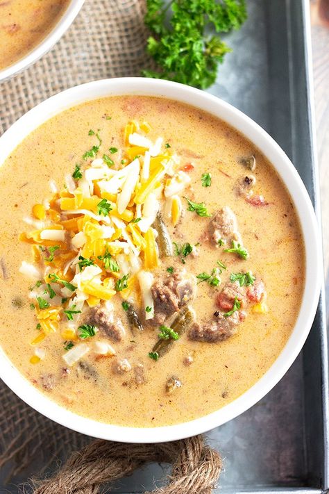 This Slow Cooker Cheeseburger Soup is comforting, warming, and tastes like a cheeseburger in creamy soup form! With lean ground beef, delicious veggies, and a cheesy broth, this soup is as hearty and flavorful as they come. Slow Cooker Cheeseburger Soup, Hamburger Rice, Recipes Slow Cooker, Cheese Burger Soup Recipes, Low Carb Soup Recipes, Cheeseburger Soup, Cheese Burger, Low Carb Soup, Soup Recipes Slow Cooker