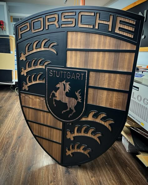 Walnut inlayed Porsche crest. #porsche #posche crest #walnut CNC Porsche Logo. Walnut and Black porsche emblem. Wood Designs, Wood Cnc Design, Porsche Symbol, Porsche Room Decor, Porsche Decorations, Porsche Vector, Porsche Showroom Interior, Wooden House Decoration, Metal Sheet Design