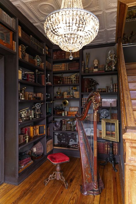 Also located in the entry library is an 18th-century French harp and a functioning phonograph, which make great conversation pieces. In fact, nearly every object in the home has a tale behind it. Decaying House, Sunroom Doors, Bedroom Decor Inspirations, Brick Mason, Victorian Bedroom, Home Kitchen Decor, Modern Victorian, Bathroom Top, Victorian Decor