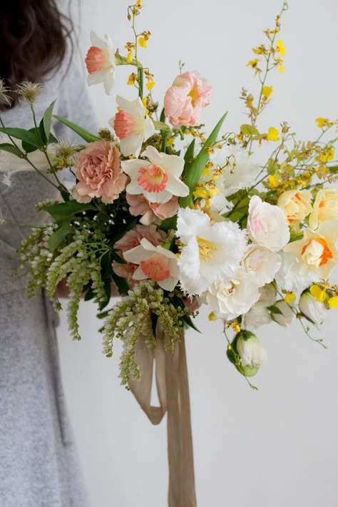 White Peach Yellow Bouquet, White Yellow Pink Bouquet, Peach And Yellow Bouquet, Peach Yellow Green Wedding, Yellow Daffodil Bouquet, Pink Yellow White Flower Arrangement, Pink And Yellow Bridal Bouquet, Early Spring Bouquet, Spring Wildflower Bouquet