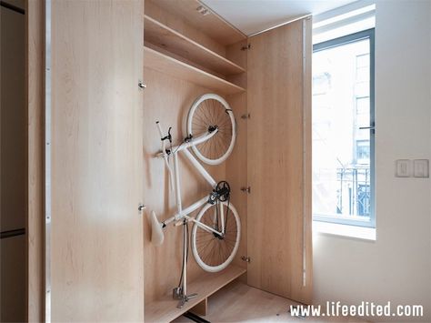 There's plenty of room for Hill's bike, which was designed by Hill and Schindelhauer Bicycles. It can be adjusted to store at just 6 inches ... Bike Storage Apartment, Space Saving Apartment, Recycled Bike Parts, Space Saving Shelves, Bike Storage Garage, Diy Space Saving, Micro Apartment, Bicycle Storage, Tiny Apartments