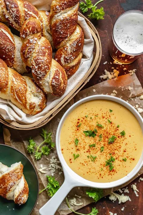 Fluffy homemade pretzels are paired with a flavorful cheddar cheese beer cheese sauce that comes together in just 15 minutes once the pretzels are baked.rnrnTwisted soft pretzels and beer cheese dip is the perfect appetizer for a gathering or game day. Mix up the recipe by making soft pretzel bites, normal-shaped pretzels, or pretzel sticks! Soft Pretzels And Beer Cheese, Pretzels And Beer Cheese, Big Game Food, Parmesan Bread Bites, Hard Pretzels, Pretzel Party, Pretzel Dip Recipes, Types Of Dips, Oktoberfest Menu