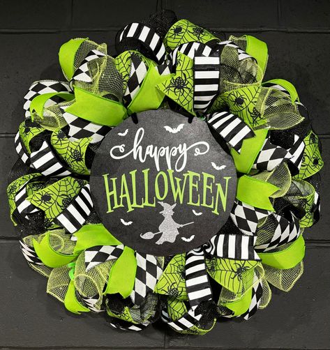 Large handmade Halloween Wreath. Made with deco mesh and assorted ribbon. Measures approximately 20x20x5 inches.  Wreaths are shipped securely in an appropriately sized box to prevent damage. Crafted and shipped from a smoke free home. Beetle Juice Wreath, Couronne Diy, Mesh Garland, Deco Mesh Garland, Hocus Pocus Party, Halloween Door Wreaths, Halloween Mesh Wreaths, Green Door, Halloween Door