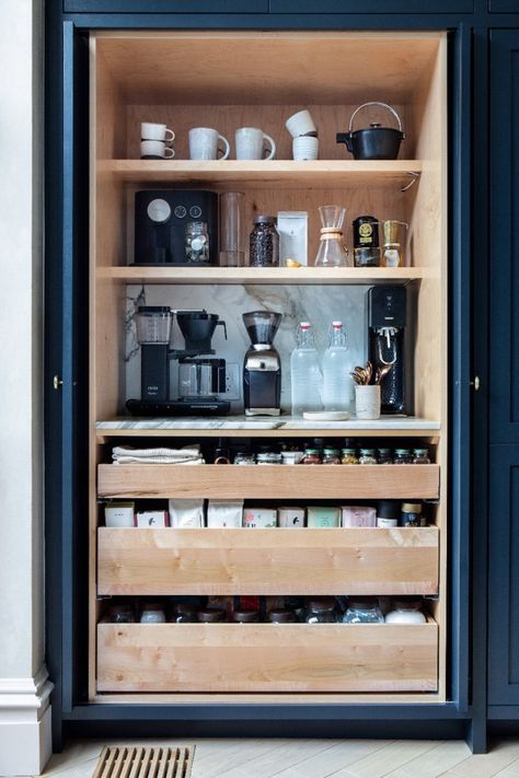 5 Kitchen Coffee Station Ideas to Optimize Your Caffeine Routine | LOTS OF STORAGE INSIDE POCKET DOORS | It’s the little details like this one has that make designing a coffee station for yourself exciting. Kaffe Station, Desain Pantry Dapur, Organiser Cucina, Coffee Station Kitchen, Bar In Casa, Tea Station, Desain Pantry, Kabinet Dapur, Home Coffee Stations