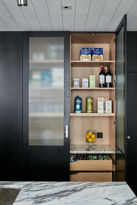 Pantries have become more popular than ever recently and the star piece in this kitchen is the larder unit with fluted glass doors, exquisitely crafted and effortlessly ethereal, perfect for showing off crockery, glasses, and vases #kitchendesign #kitcheninspo #kitchendecor Pantry Cupboard Designs, Kitchen Tall Units, Land Photography, Crockery Unit Design, Glass Cupboard, Kitchen Cabinets Ideas, Glass Pantry Door, Glass Pantry, Kitchen Larder