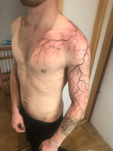 Lightning Tattoo Designs Men, Chest Lightning Tattoo, Lighting Tattoo On Shoulder, Lighting Sleeve Tattoo, Lighting Design Tattoo, Thunder Tattoo Shoulder, Lighting Shoulder Tattoo, Lightning Sleeve Tattoo, Black Lightning Tattoo