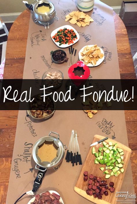 Real Food Fondue | Fondue is commonly served as dessert, such as strawberries dipped in melted chocolate; but it is lots of fun to make an entire meal of fondue! It's so much fun to gather around a table and enjoy amazing finger food. Your hands and a skewer are all you need! | TraditionalCookingSchool.com New Years Fondue, Fondue Party Ideas Decor, Fondue Dinner Party Table, Fondue For A Crowd, Healthy Fondue Recipes, Fondue Party Table Setting, Fondue Table Setting Ideas, Fondue Table, Party Food Easy Cheap