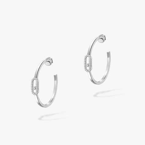 Messika Move Uno 18ct White Gold Diamond Small Hoop Earrings 12485/WG Since its origins, Maison Messika has succeeded in combining the timelessness of the diamond with a modern touch. Diamond jewellery in a contemporary style to be worn everyday. Messika jewels encourage women to become what they are: brilliant, free, sensual, sparkling and more. A woman who is modern, confident in herself, who chooses the diamond as an everyday companion as well as to mark the most beautiful occasions in her li Diamond Earrings For Women, Gold Diamond Hoop Earrings, White Gold Diamond Earrings, Silver Diamond Earrings, Womens Earrings Studs, White Gold Set, Latest Jewellery, Women Diamond, Diamond Hoop Earrings